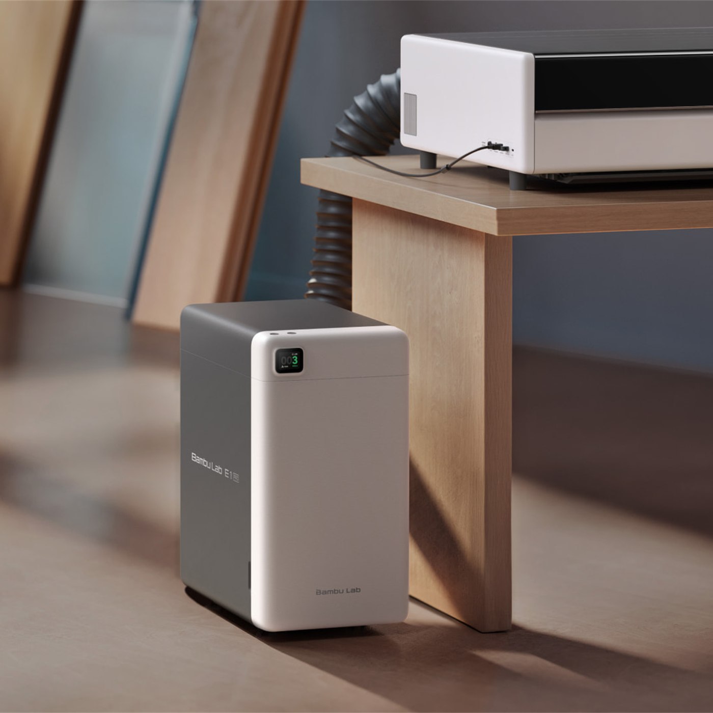 Bambu Lab E1 Pro air purifier connected to the R1 exhaust
