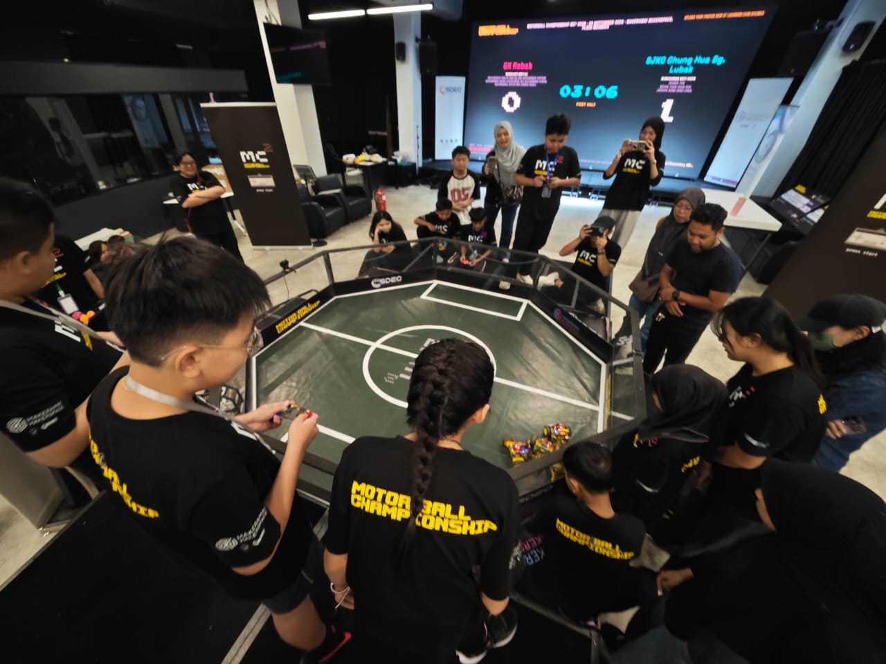 Students around the arena at the Motorball Championship