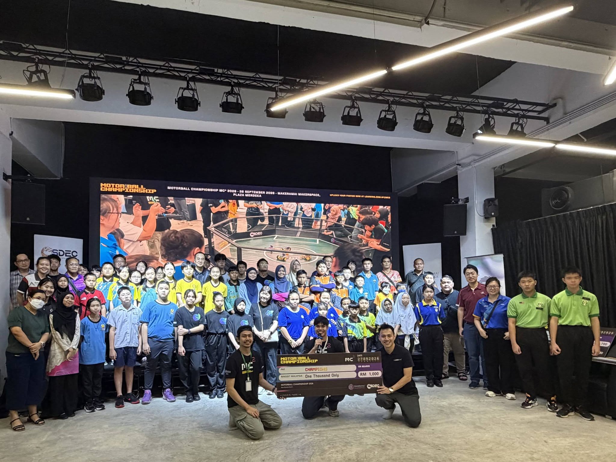 Students, teams and organisers gathered around the Motorball Championship pitch.